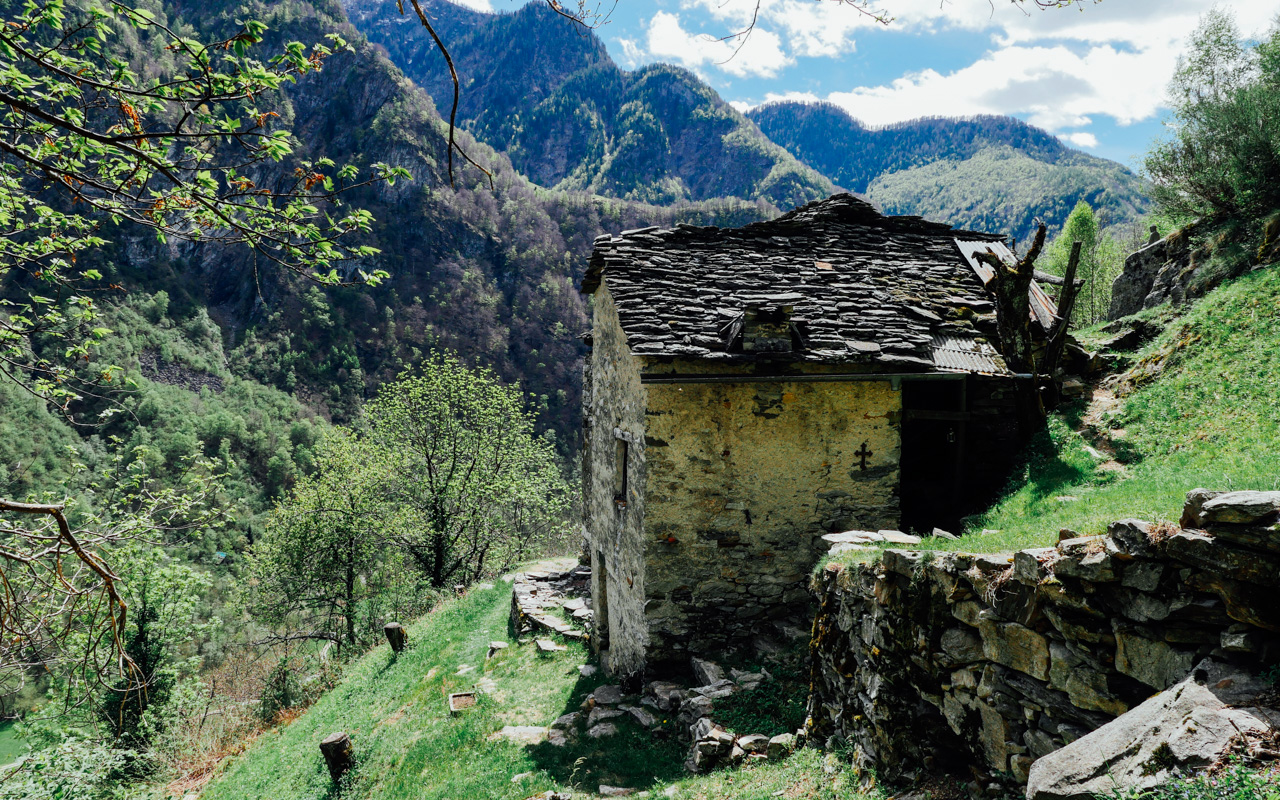 Stone huts are scattered around the hiking trail.